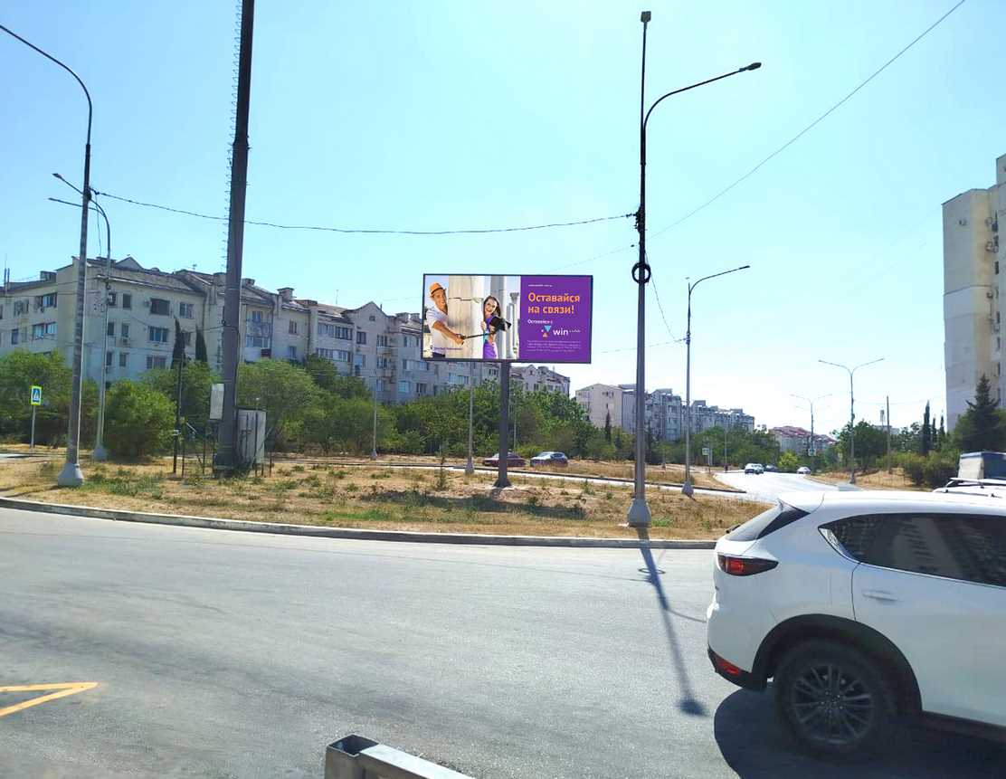 Фотография рекламного носителя, тип: Билборд 3x6, адрес: Александра Маринеско ул., д.6, Евпатория, Республика Крым, Россия. Сторона B №1377049