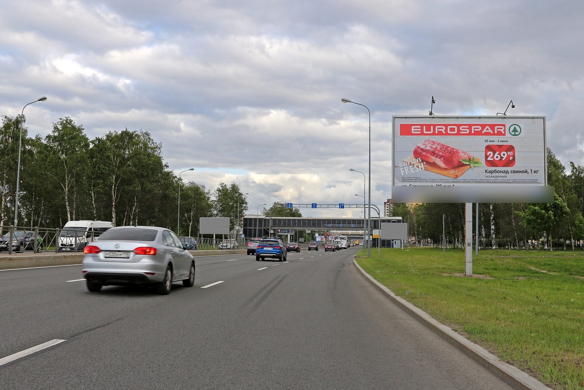 Фотография рекламного носителя, тип: Билборд 3x6, адрес: Приморское ш. X Школьная ул., д.71, корп.1, Санкт-Петербург, Россия. Сторона А №153559