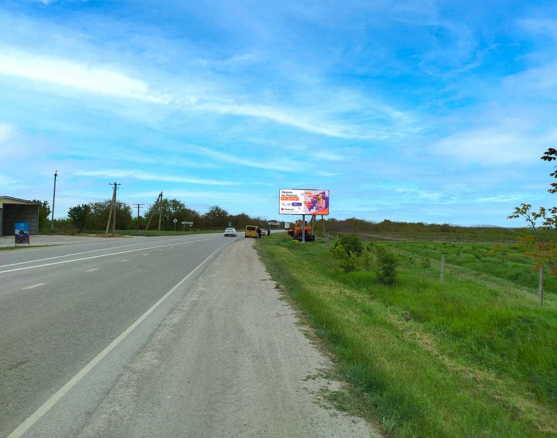 Фотография рекламного носителя, тип: Билборд 3x6, адрес: Кировское - Первомайское 19 763м, на выезде из Первомайского, поз.1, Кировское, Донецкая область, Россия. Сторона A №1377036