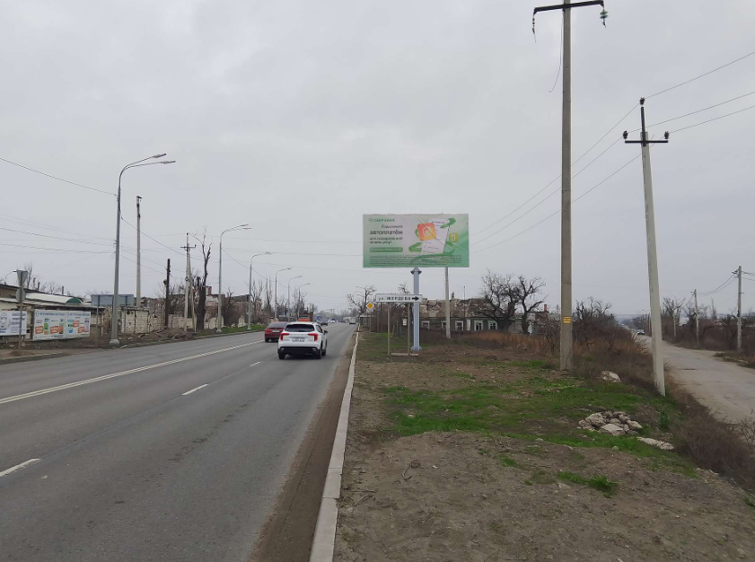 Фотография рекламного носителя, тип: Билборд 3x6, адрес: Голубенко ул. X Лазо ул., поз.1, Мариуполь, Донецкая область, Россия. Сторона A №1361377