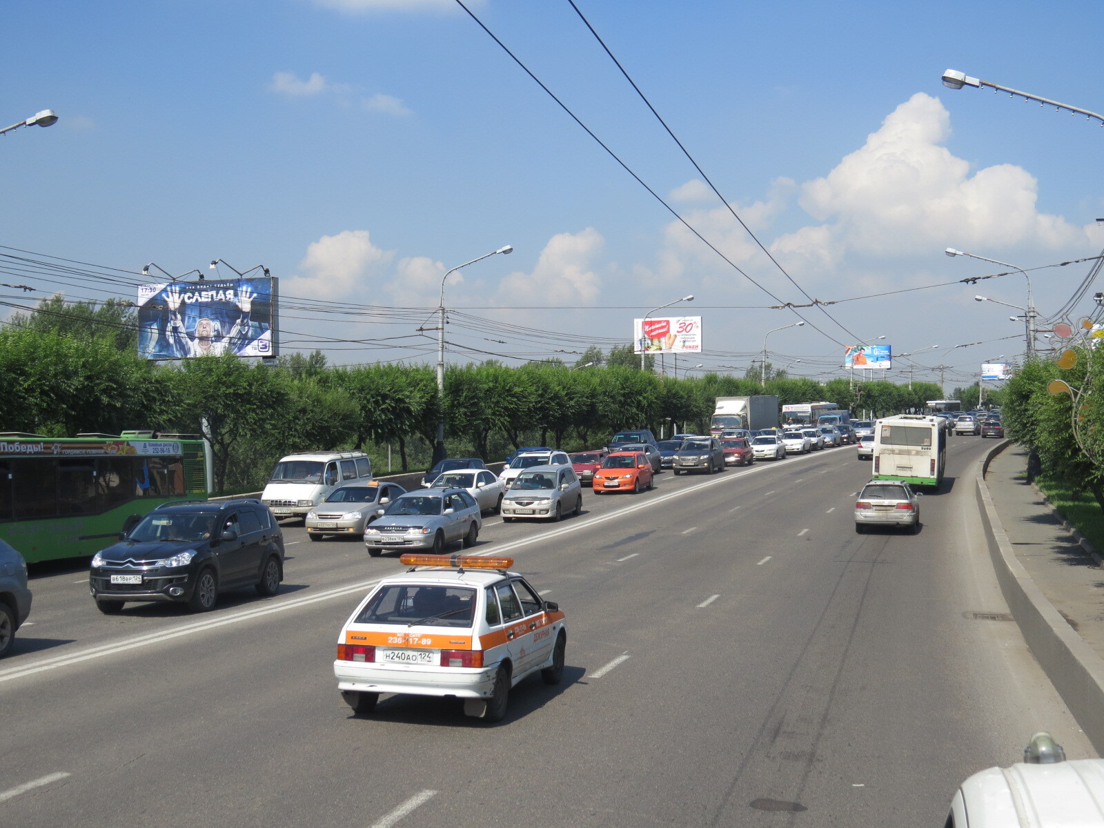 Фотография рекламного носителя, тип: Билборд 3x6, адрес: Коммунальный мост, 25 м до остановки, Красноярск, Красноярский край, Россия. Сторона Б1 №88402