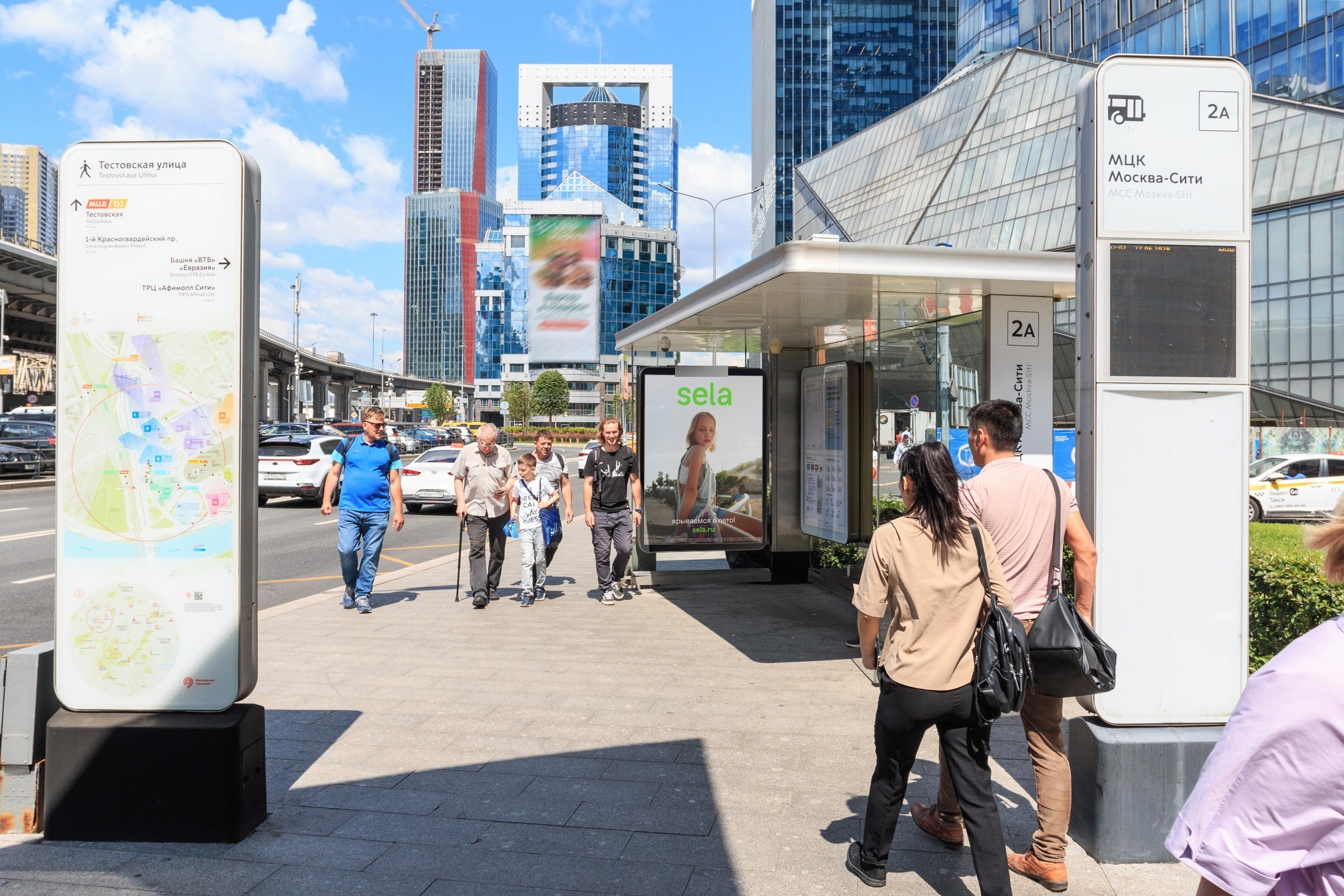 Фотография рекламного носителя, тип: Остановка 1.8x1.2, адрес: Тестовская ул., в районе Пресненской наб., д.11, поз.2, Москва, Россия. Сторона А1 №934419