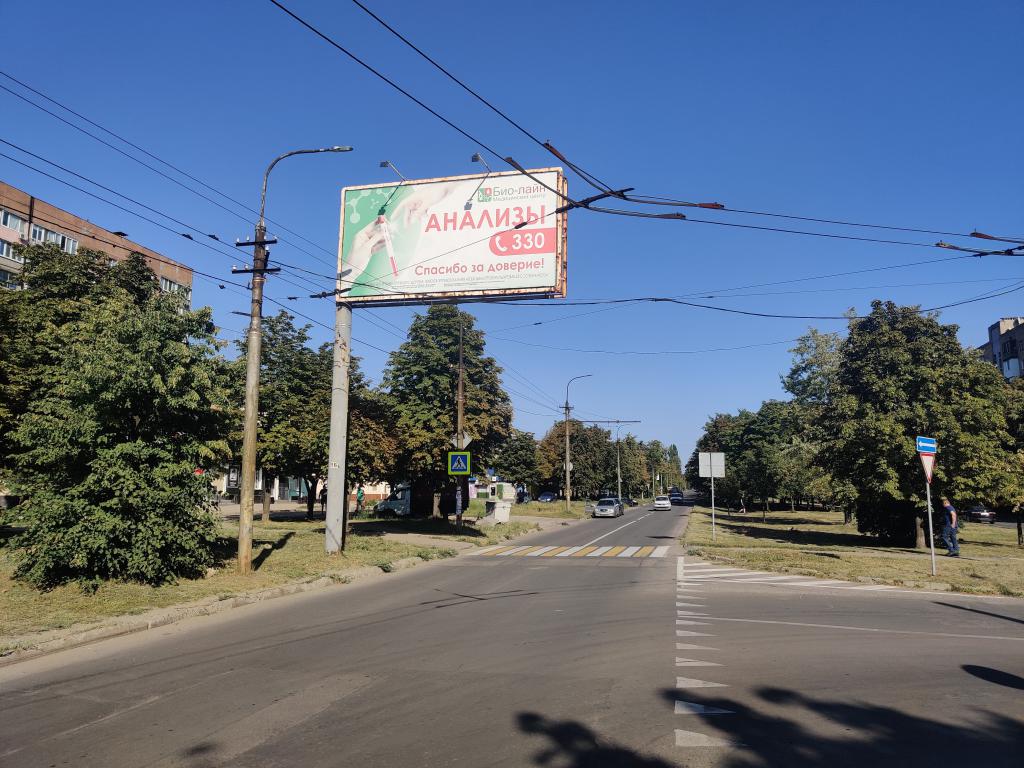 Фотография рекламного носителя, тип: Билборд 3x6, адрес: Раздольная ул. Х 301-й Стрелковой Дивизии ул., Донецк, Донецкая область, Россия. Сторона В №1327632