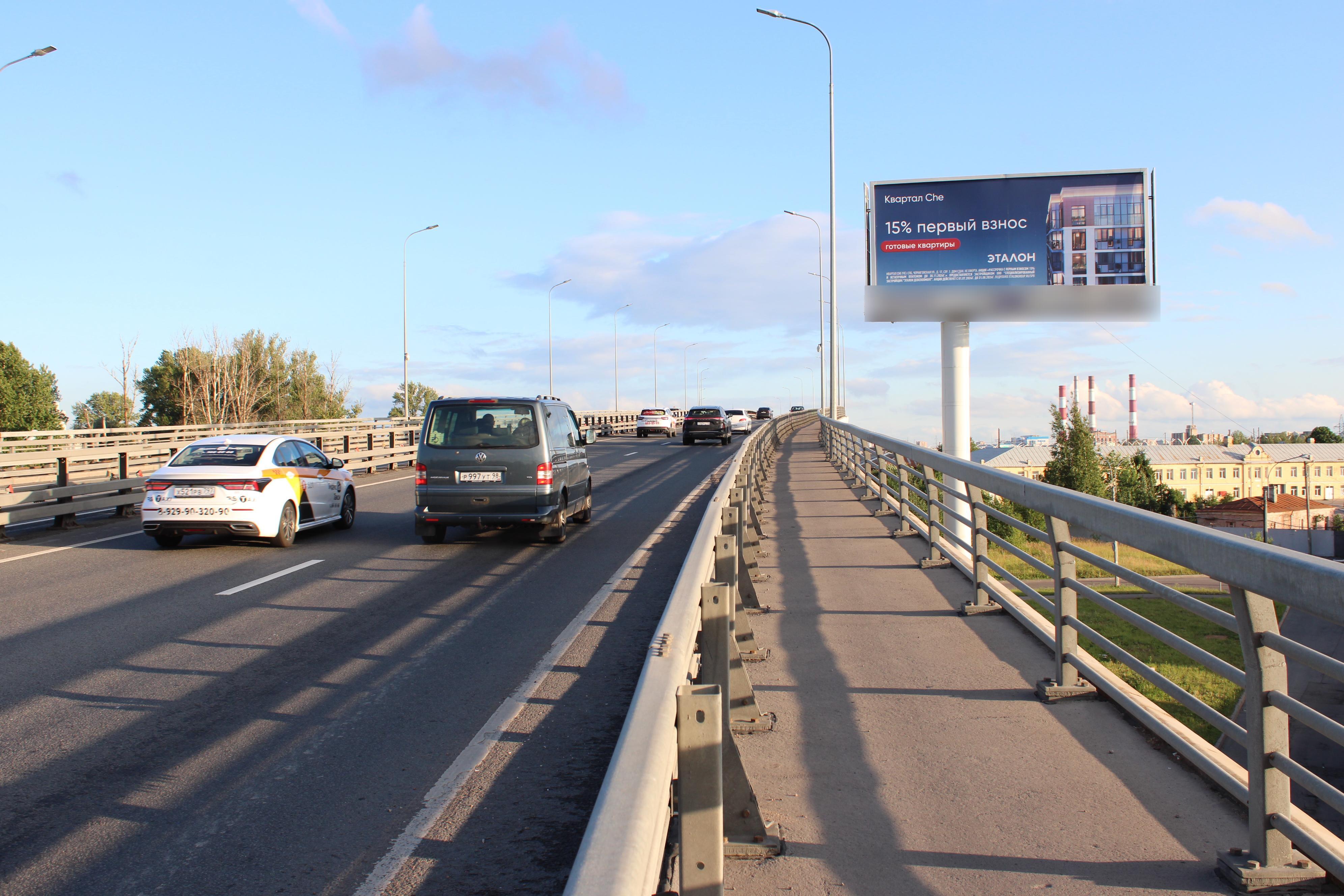 Фотография рекламного носителя, тип: Суперсайт 5x12, адрес: Митрофаньевское ш. Х Ялтинская ул., Санкт-Петербург, Россия. Сторона А №1088582