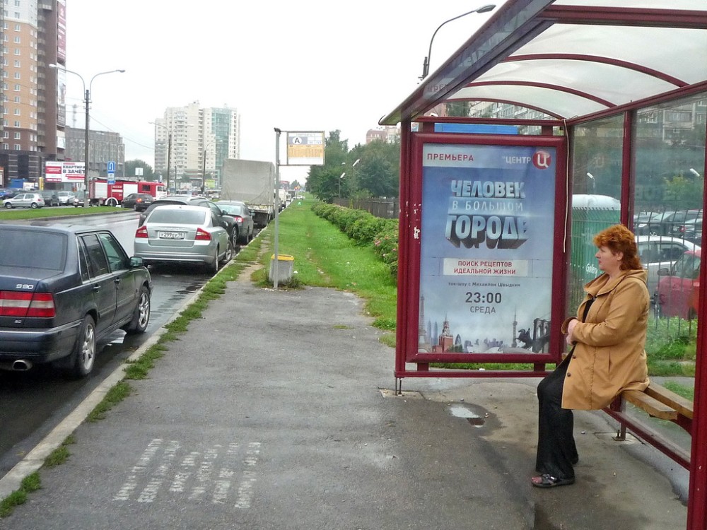 Фотография рекламного носителя, тип: Остановка 1.8x1.2, адрес: Северный пр-т., д.12, Санкт-Петербург, Россия. Сторона А №129783