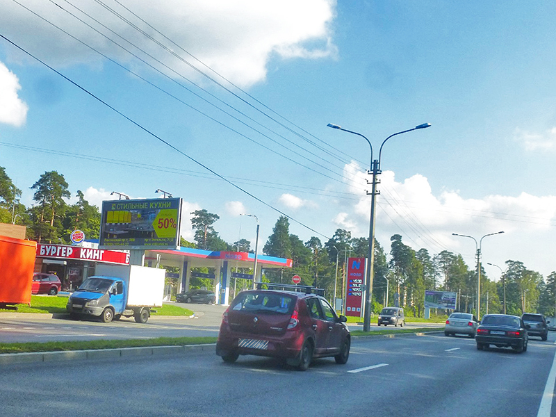 Фотография рекламного носителя, тип: Билборд 3x6, адрес: Приморское ш., д.251, Санкт-Петербург, Россия. Сторона B №169781