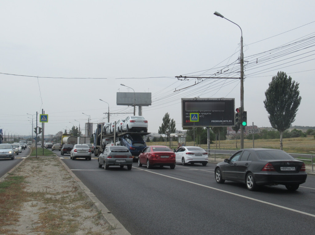 Фотография рекламного носителя, тип: Билборд 3x6, адрес: Университетский пр-т., ост. "Госуниверситет", Волгоград, Волгоградская область, Россия. Сторона А1-А3 №111433