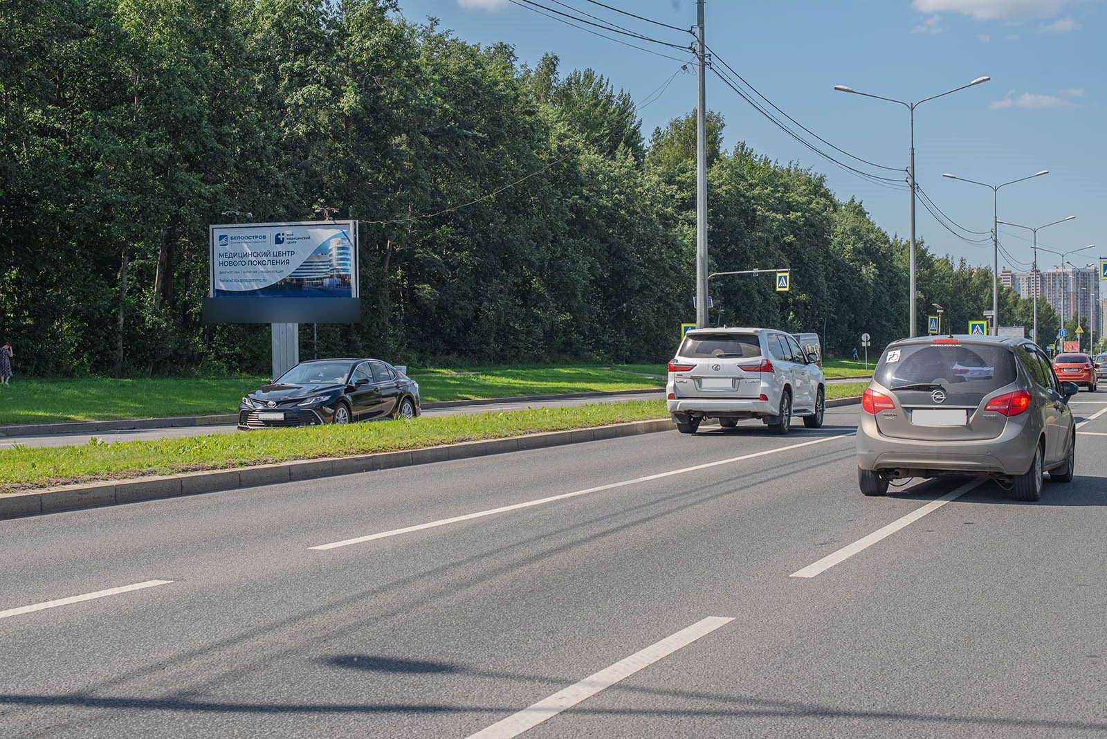 Фотография рекламного носителя, тип: Билборд 3x6, адрес: Северный пр-т., д.32 X Тихорецкий пр-т., Санкт-Петербург, Россия. Сторона B №168825