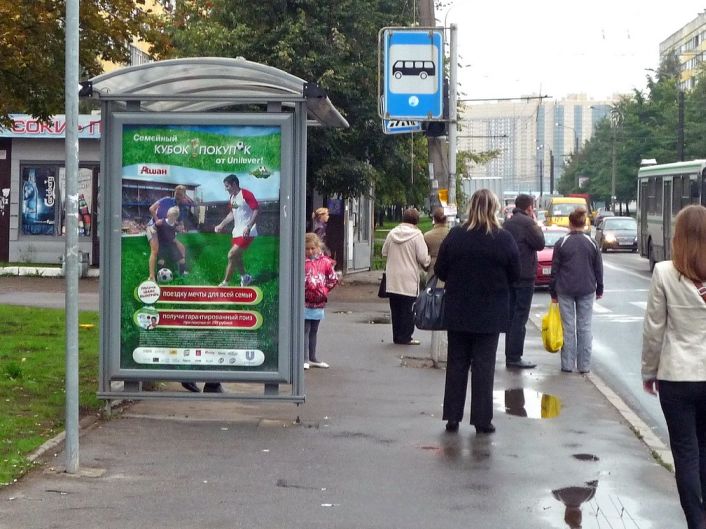 Фотография рекламного носителя, тип: Остановка 1.8x1.2, адрес: Композиторов ул., д.22, корп.1, Санкт-Петербург, Россия. Сторона Б №129732