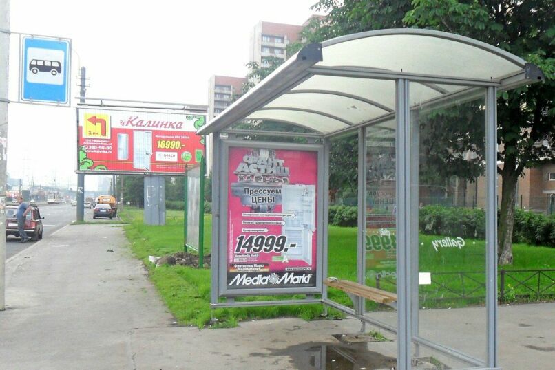 Фотография рекламного носителя, тип: Остановка 1.8x1.2, адрес: Испытателей пр-т., д.18, корп.1, Санкт-Петербург, Россия. Сторона А №130777
