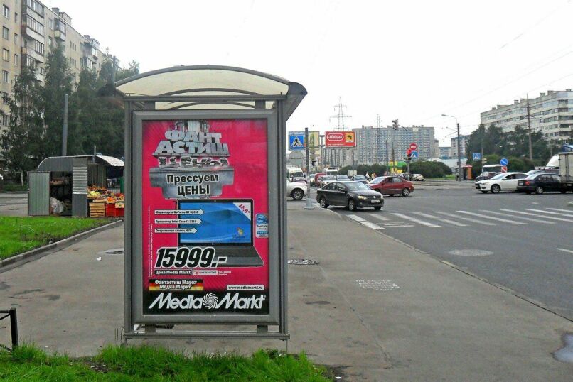 Фотография рекламного носителя, тип: Остановка 1.8x1.2, адрес: Испытателей пр-т., д.18, корп.1, Санкт-Петербург, Россия. Сторона Б №130778