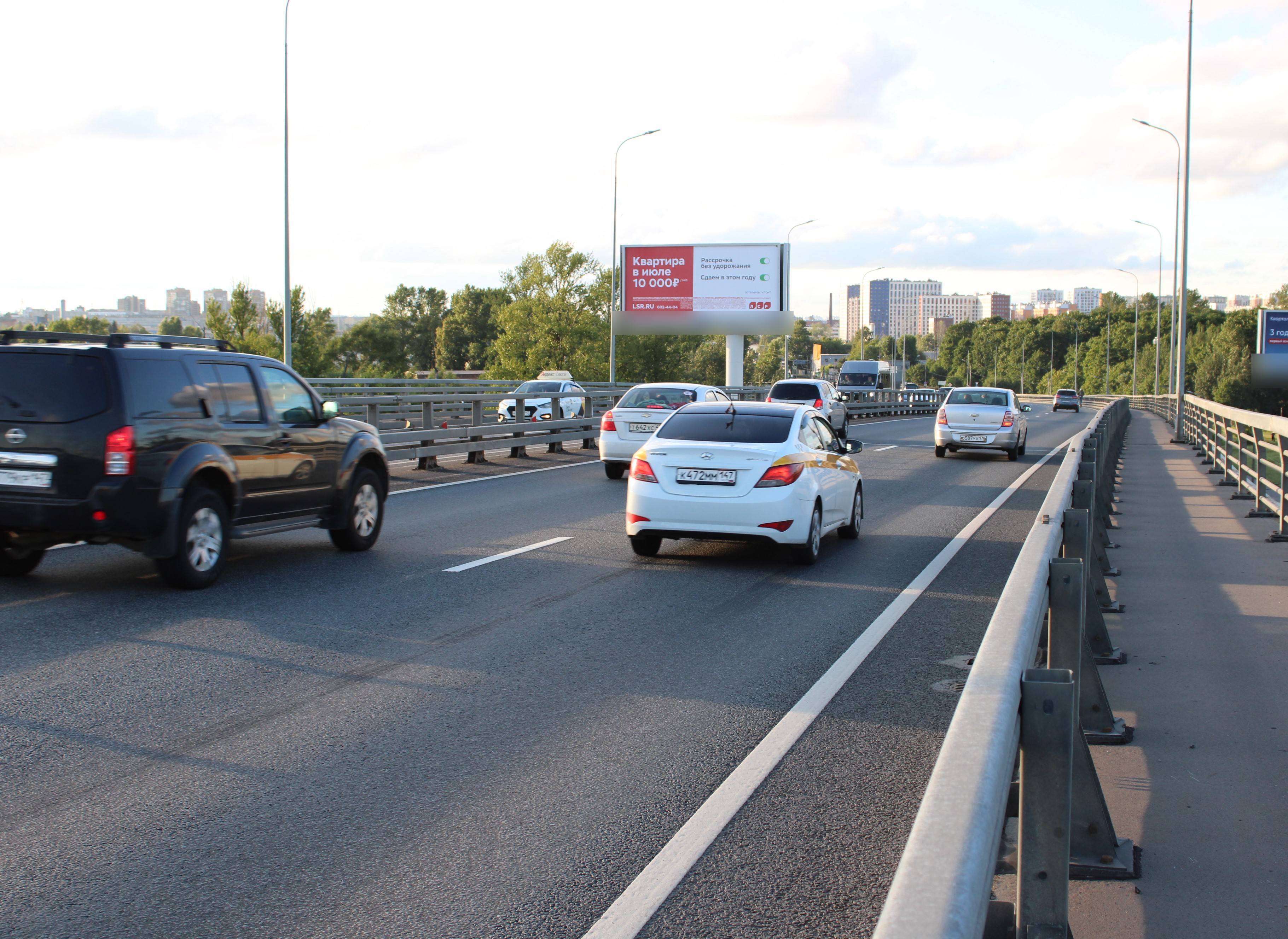 Фотография рекламного носителя, тип: Суперсайт 5x12, адрес: Митрофаньевское ш. Х Ялтинская ул., Санкт-Петербург, Россия. Сторона Б №1079755