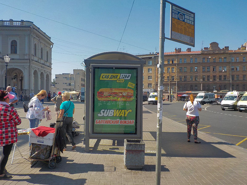 Фотография рекламного носителя, тип: Остановка 1.8x1.2, адрес: Балтийский вокзал пл. X Обводного канала наб., д.120, лит.Б, поз.2, Санкт-Петербург, Россия. Сторона В №164100