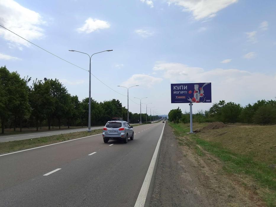 Фотография рекламного носителя, тип: Билборд 3x6, адрес: Донецкое ш., 750м до Новосибирская ул., Мариуполь, Донецкая область, Россия. Сторона A №1372502