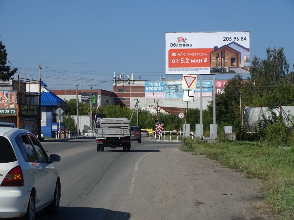 Фотография рекламного носителя, тип: Билборд 3x6, адрес: Восточное ш., у ж/д переезда, Новосибирск, Новосибирская область, Россия. Сторона A №183698