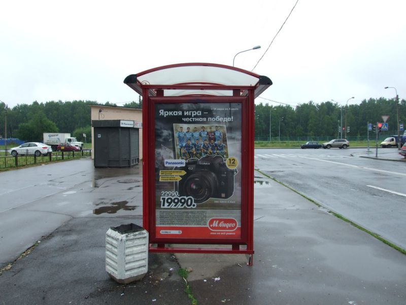 Фотография рекламного носителя, тип: Остановка 1.8x1.2, адрес: Ударников пр-т., д.56, корп.1, Санкт-Петербург, Россия. Сторона Б №130057