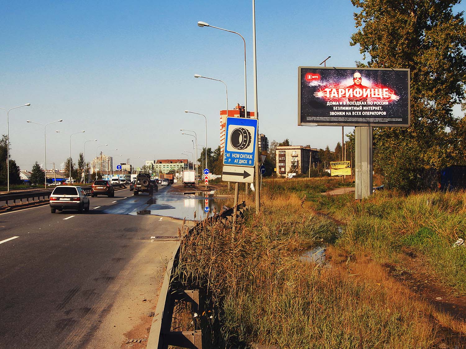 Фотография рекламного носителя, тип: Билборд 3x6, адрес: Октябрьская наб., перед вантовым мостом КАД, Санкт-Петербург, Россия. Сторона А №131520