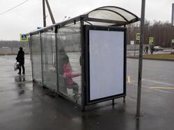 Фотография рекламного носителя, тип: Остановка 1.8x1.2, адрес: Авиаконструкторов пр-т. Х Глухарская ул., Санкт-Петербург, Россия. Сторона Б №129971